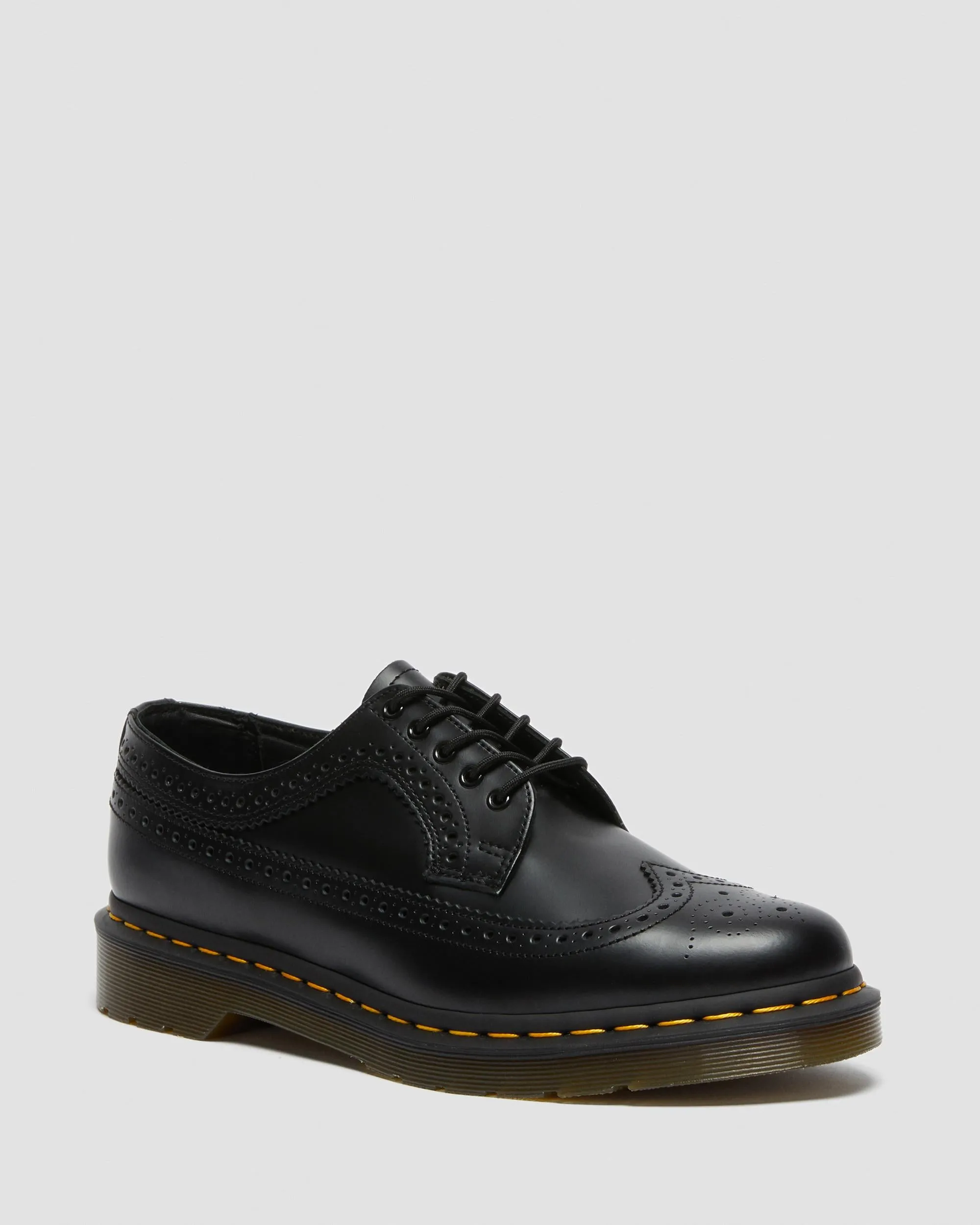 3989 Yellow brogue shoes made of smooth leather with Dr stitching. Martens