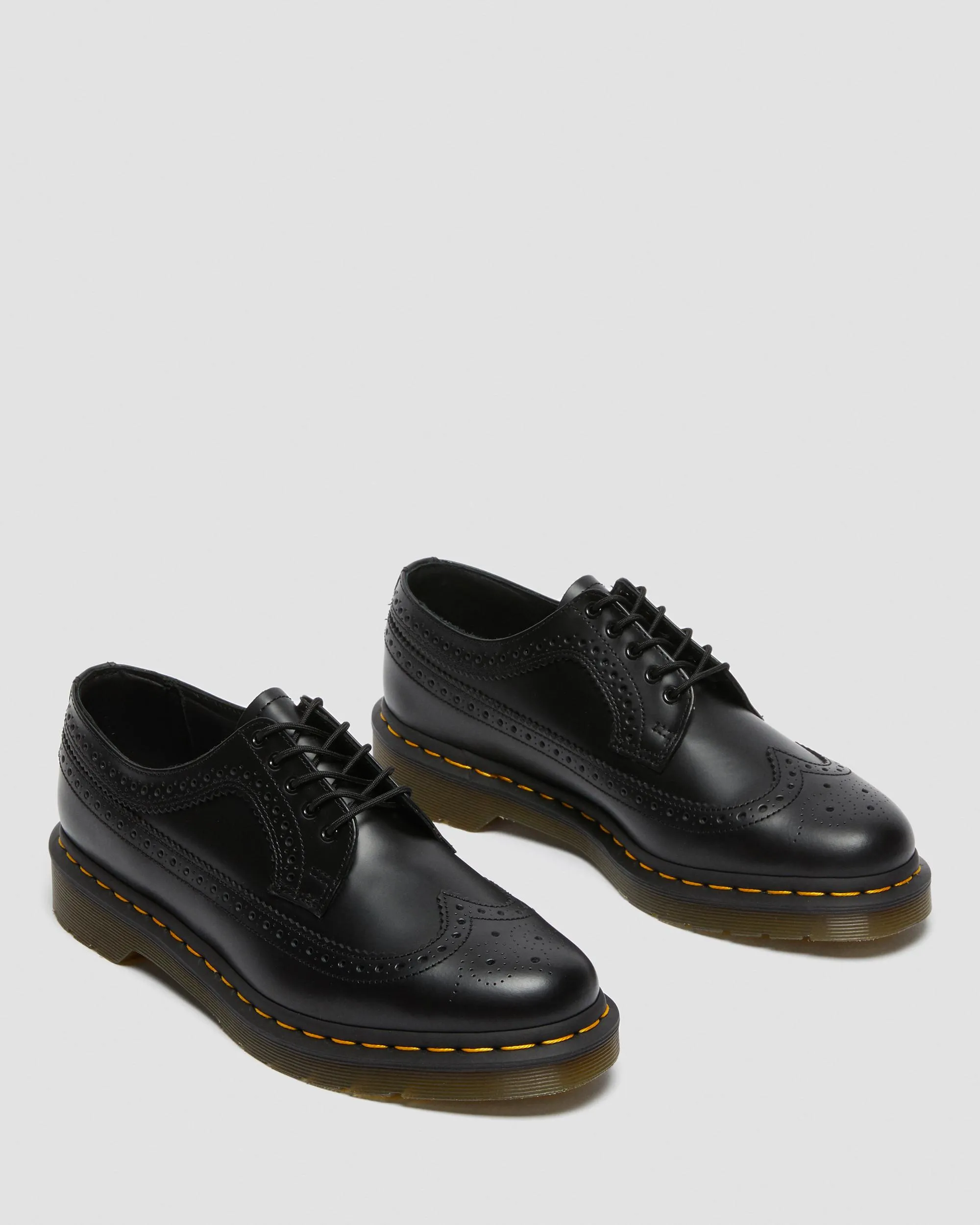 3989 Yellow brogue shoes made of smooth leather with Dr stitching. Martens