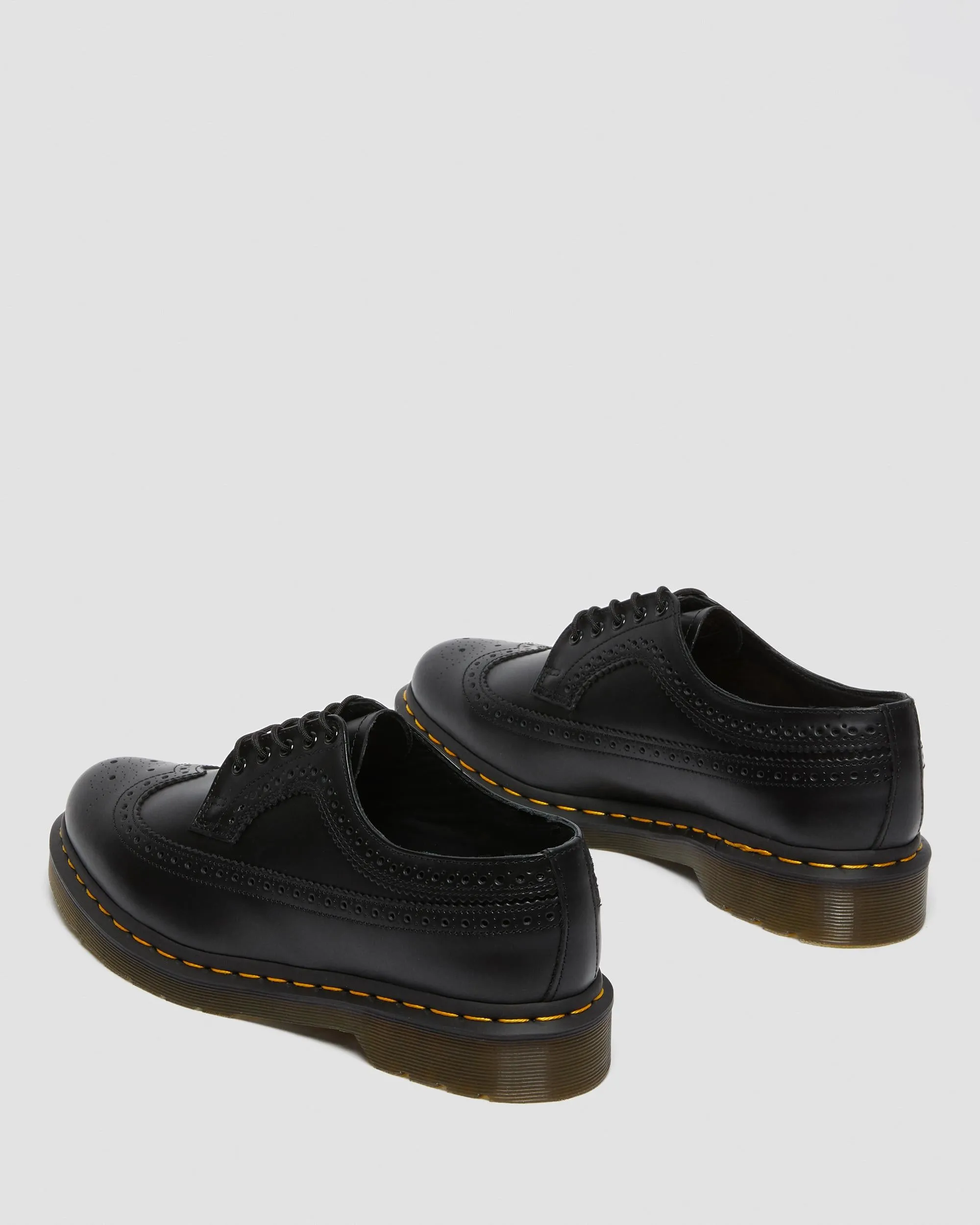 3989 Yellow brogue shoes made of smooth leather with Dr stitching. Martens