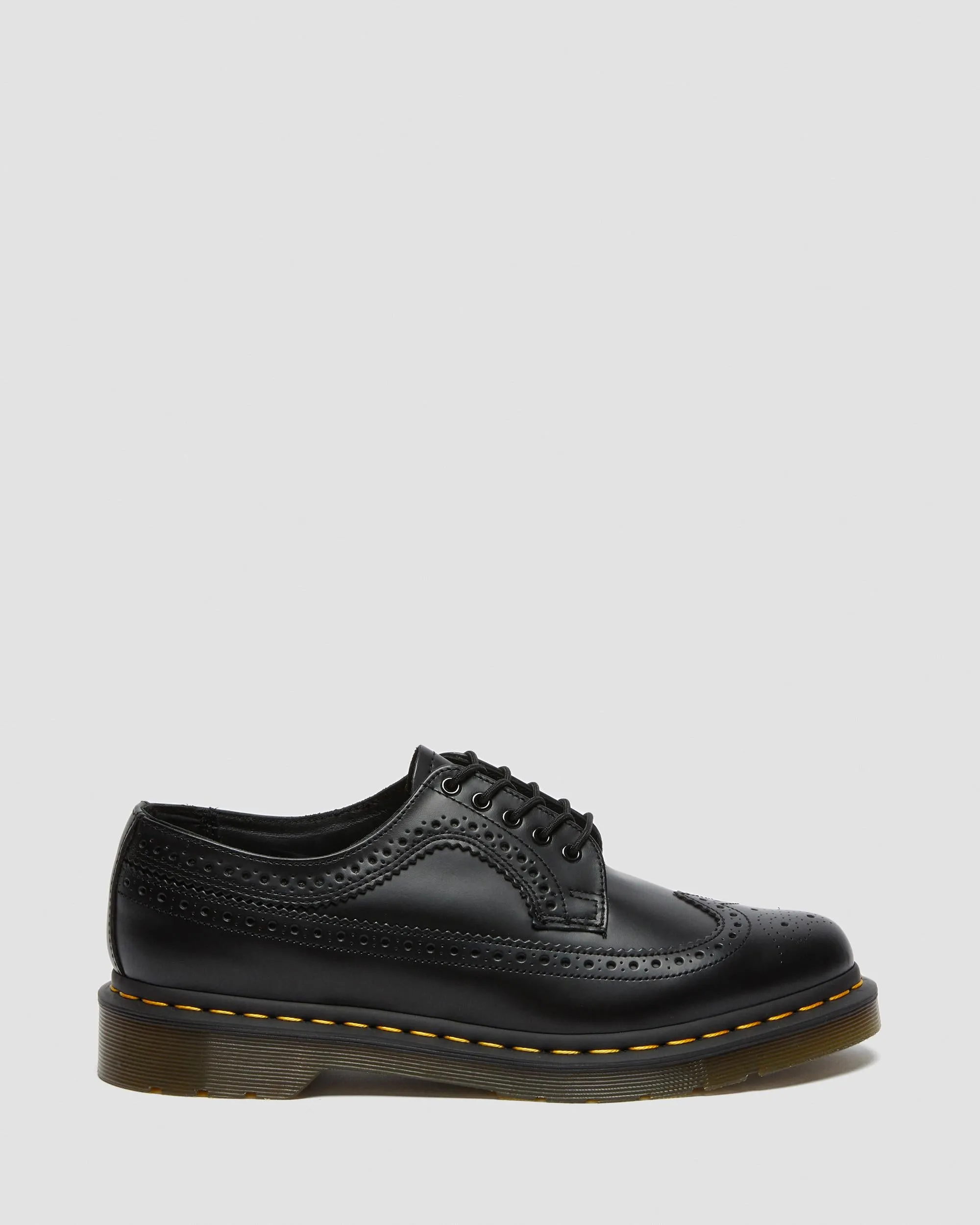 3989 Yellow brogue shoes made of smooth leather with Dr stitching. Martens