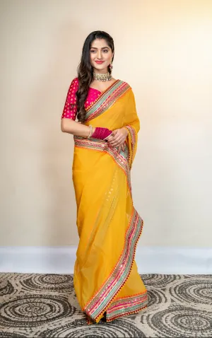 Women Yellow Organza Saree With Multicolor Border